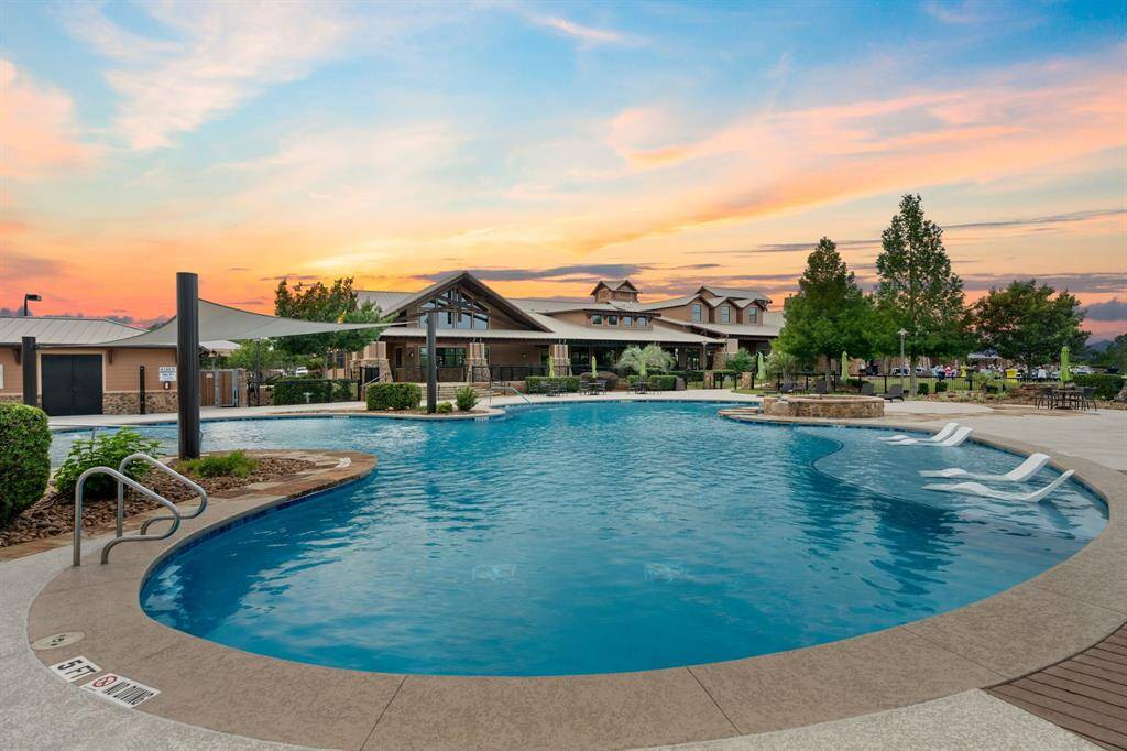 The outdoor pool is an ideal spot to relax and make new friendships, offering a refreshing atmosphere where neighbors can gather, unwind, and enjoy each other’s company under the sun.