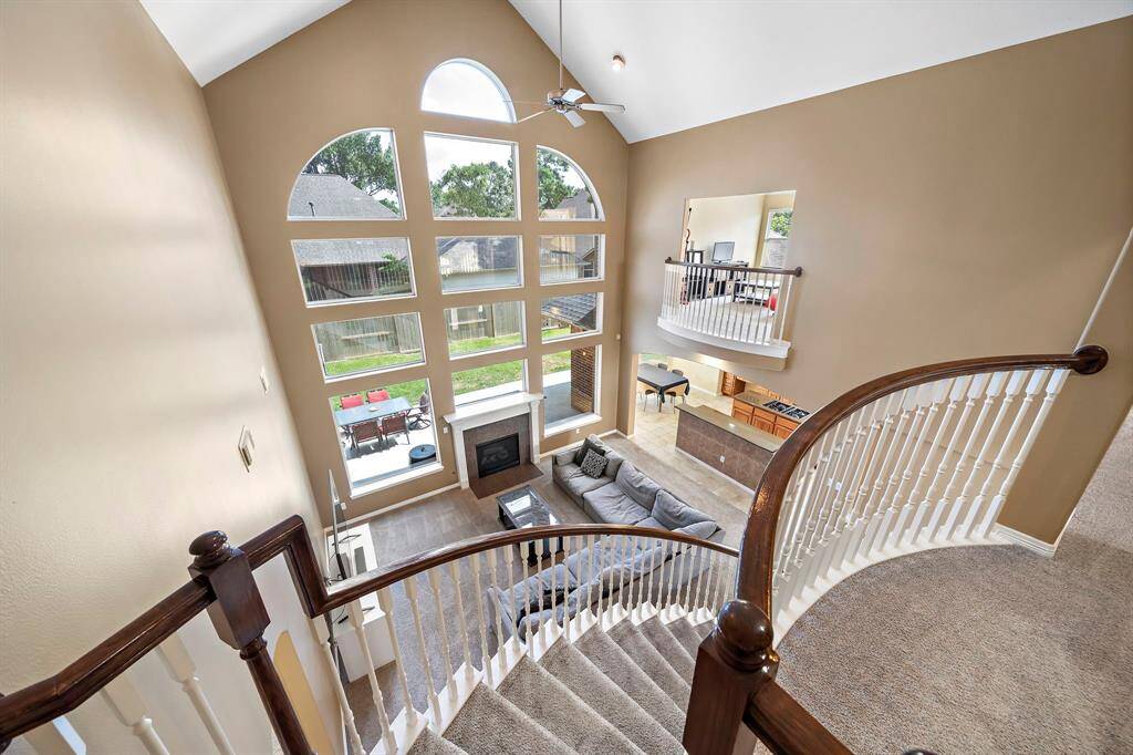 Take in the grand view from the stairs, showcasing a stunning overlook of the spacious living areas below.