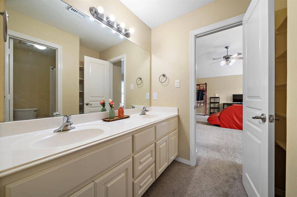 Third Bathroom Offering Double Sinks.