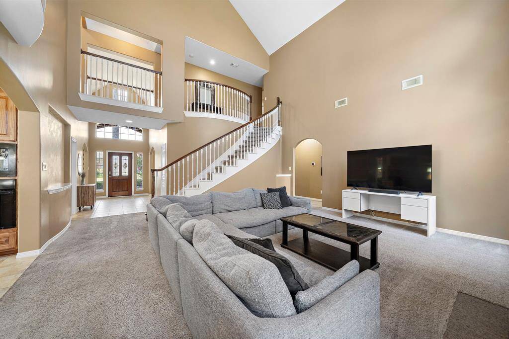 Unwind in style with a living room designed for comfort and elegance.