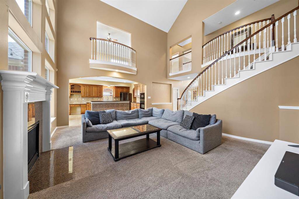 Enjoy seamless living with a spacious living room that flows smoothly into the kitchen and breakfast area.