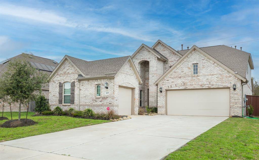 This modern brick home includes a private Next Gen suite, perfect for multi-generational living.