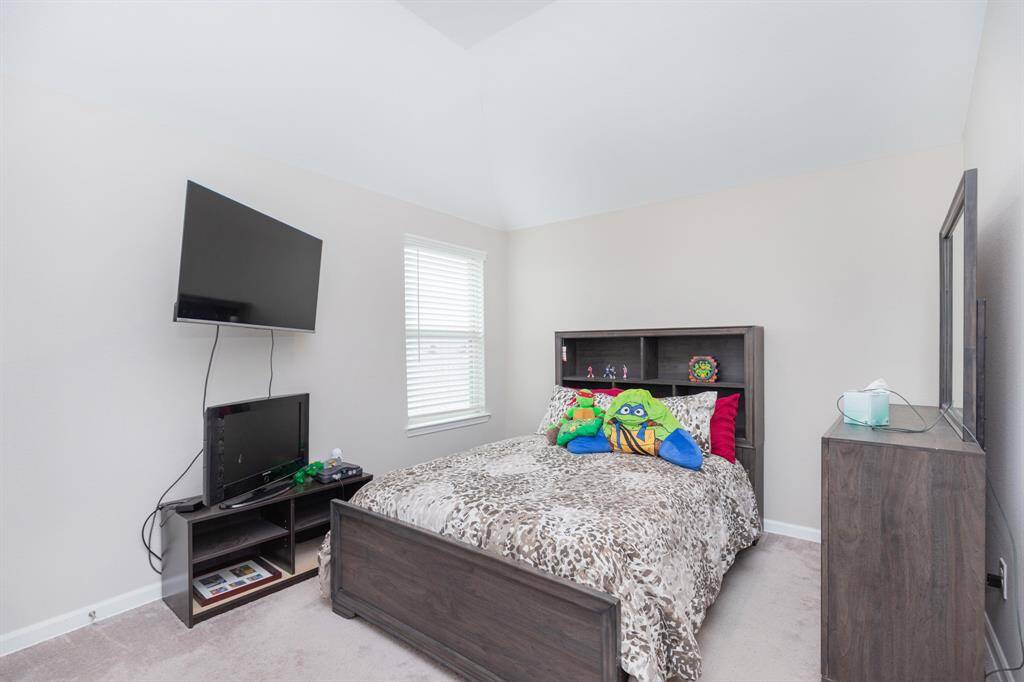 bedroom 3 natural light comes through a window, creating a bright and inviting space.