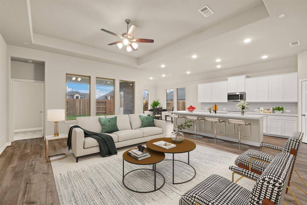 This home boasts a spacious open concept layout that combines the best of modern design and comfort for everyday living. Photo is virtually staged