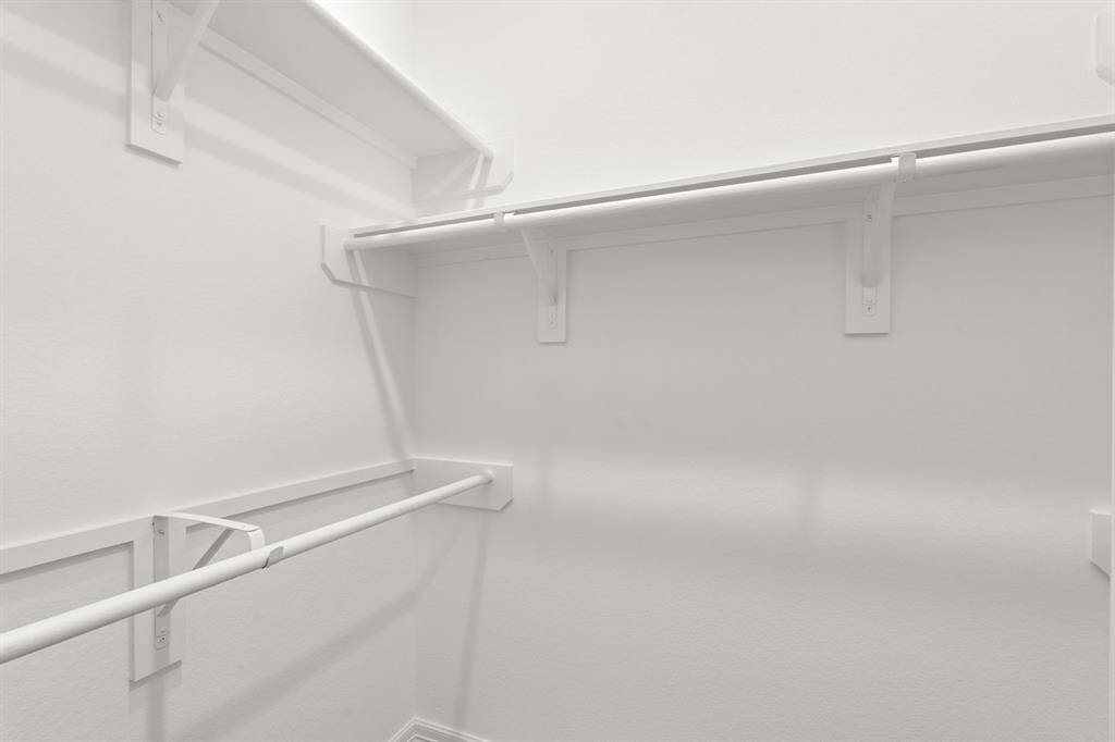 A view of your large primary walk-in Closet