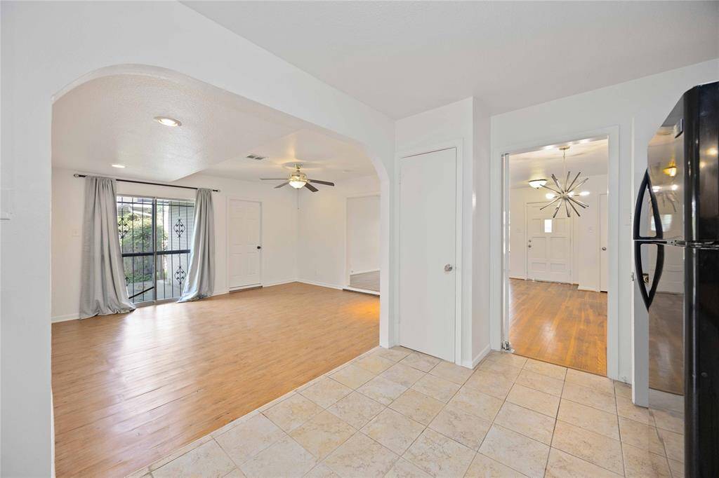 The kitchen looks into the family room