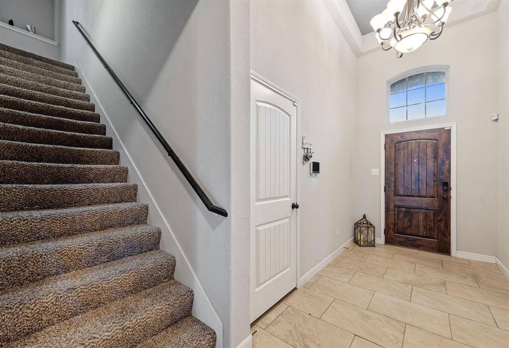 When you enter the stairs on your right go to the large room with full bath. This flex room could be a bedroom. game room or a home office