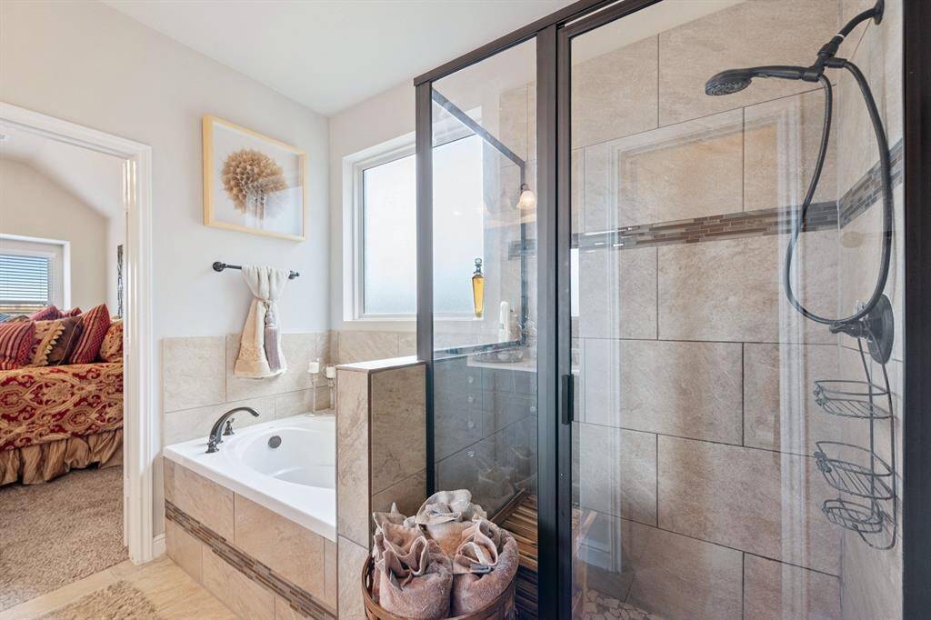 Primary bathroom with Tub and shower.