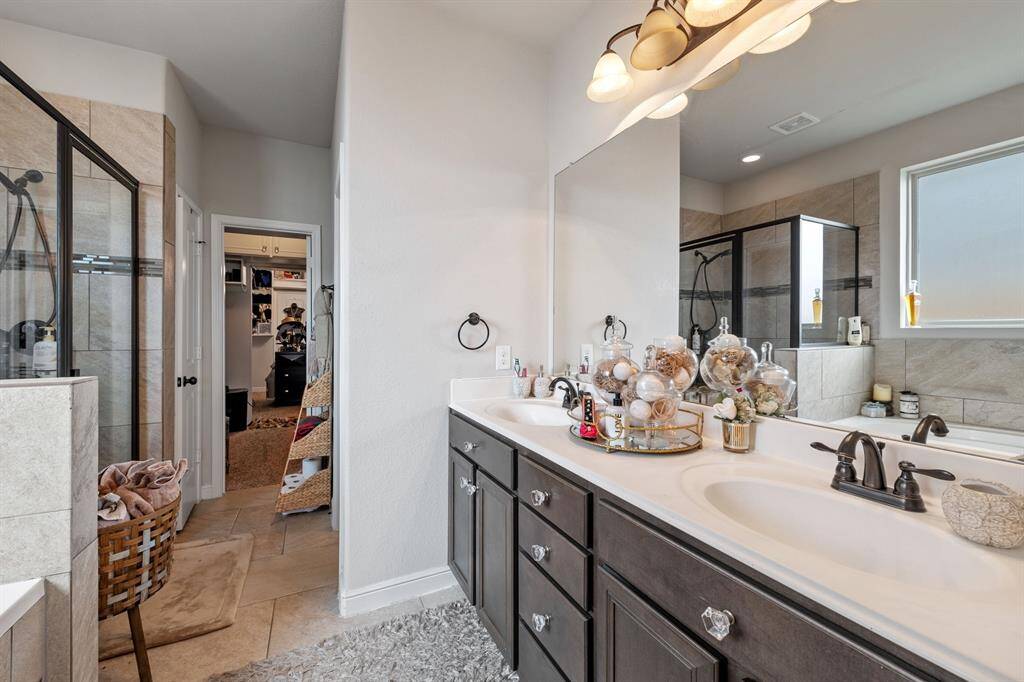 Double sinks, with two walk-in closets.