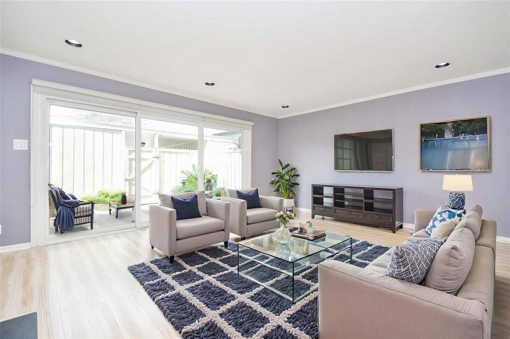 Experience modern elegance in this living room. Abundant natural light, and a seamless indoor-outdoor connection through large sliding doors. Perfect for relaxation and entertaining. (virtually staged)*