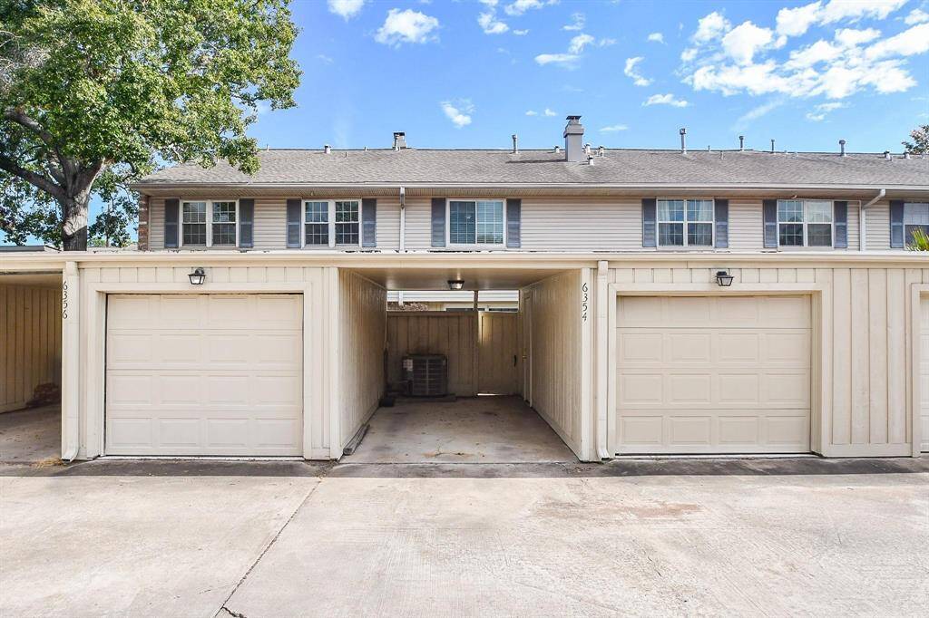 This photo features your covered carport next to your single-car garage.