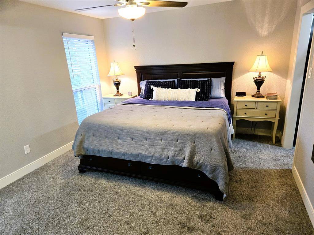 Giant primary bedroom has room for this king sized bed