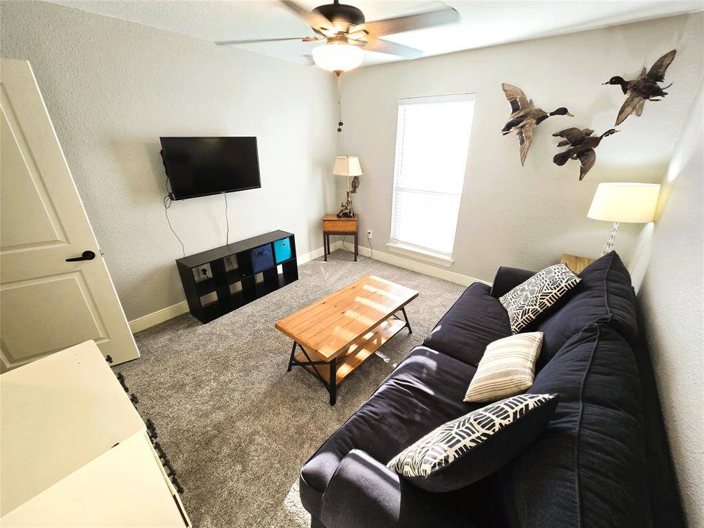 Third bedroom with fold out couch works as a game room
