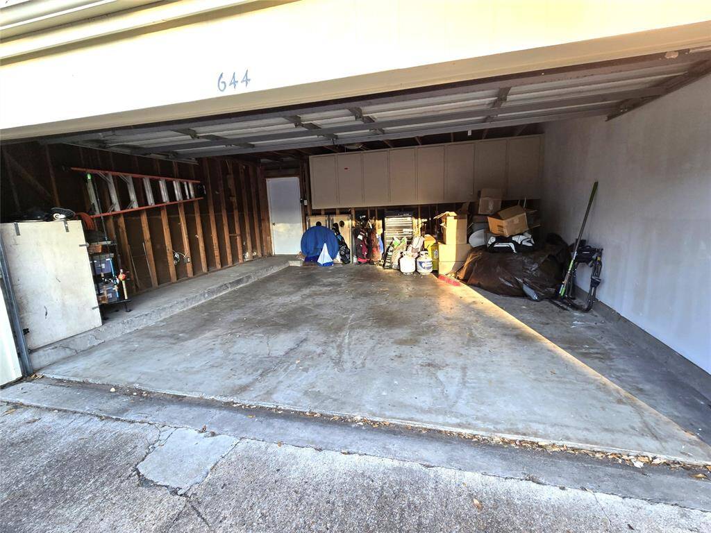 Large garage has extra space to the side for bikes and tools