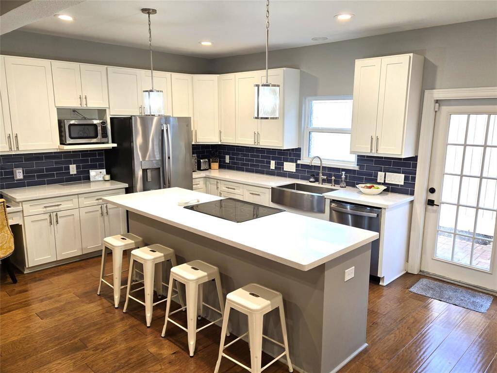 Large kitchen island will be the centerpiece of this kitchen. Four seat breakfast bar