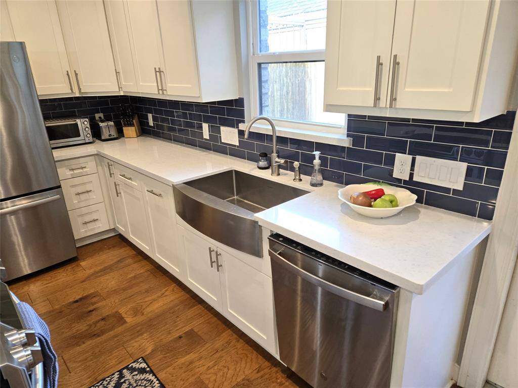 Custom cabinets and a stainless farmhouse sink
