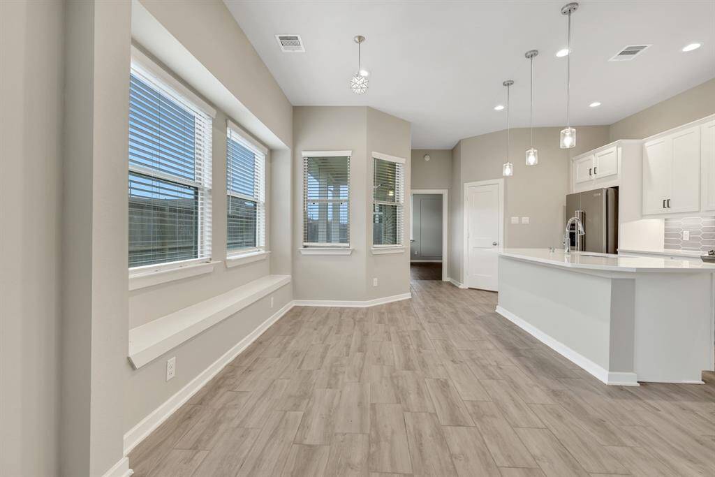 Kitchen also offers plenty of natural light with windows all around