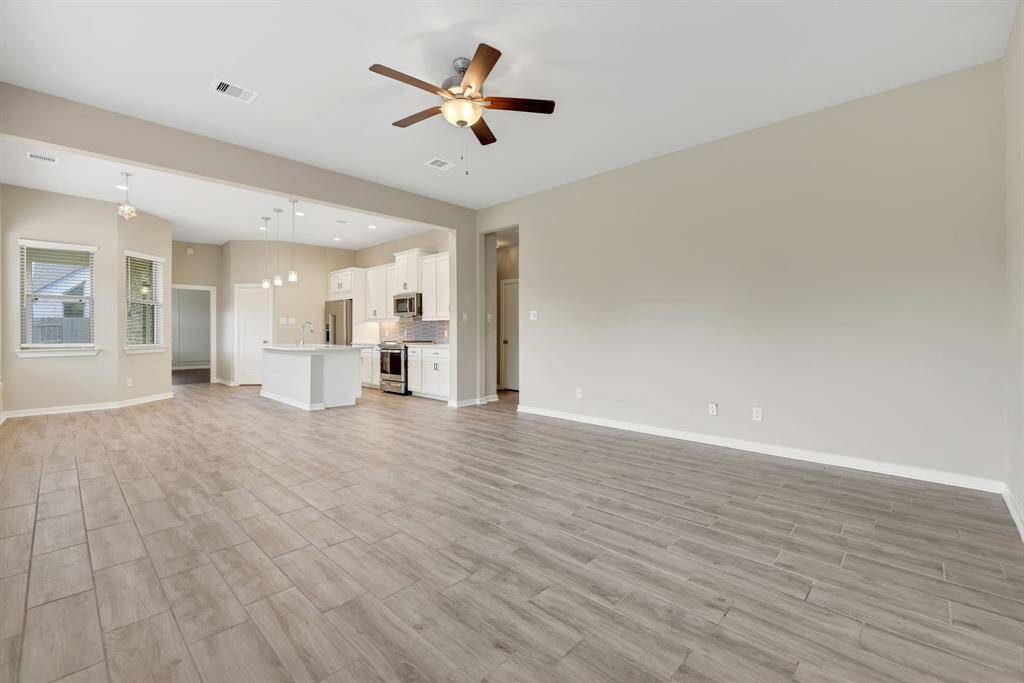 Family room is spacious and connected to kitchen
