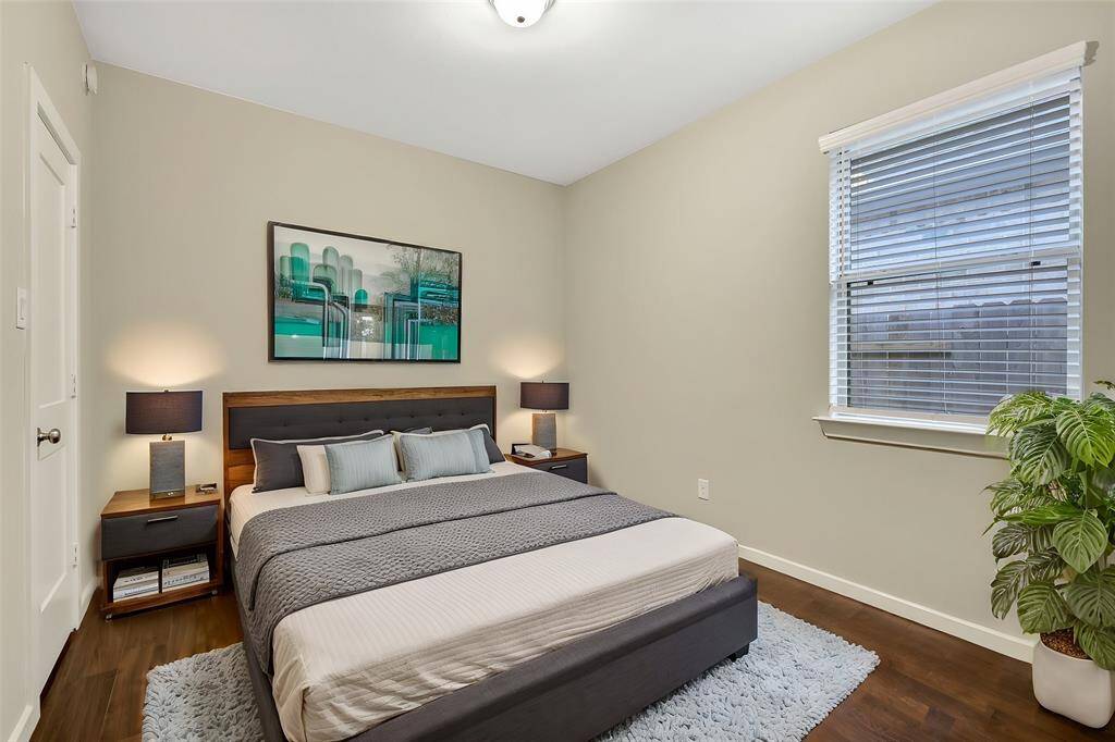 This home features 3 bedrooms down. This is one of the secondary bedrooms that is down