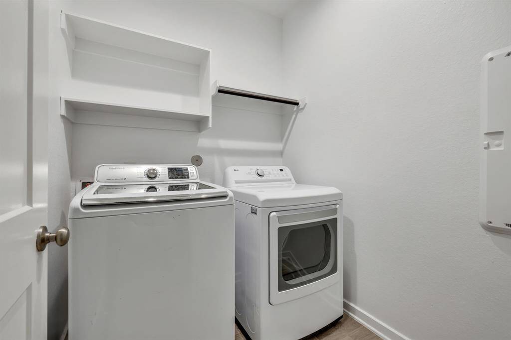 Utility room conveniently located downstairs - home comes equipped with washer and dryer!