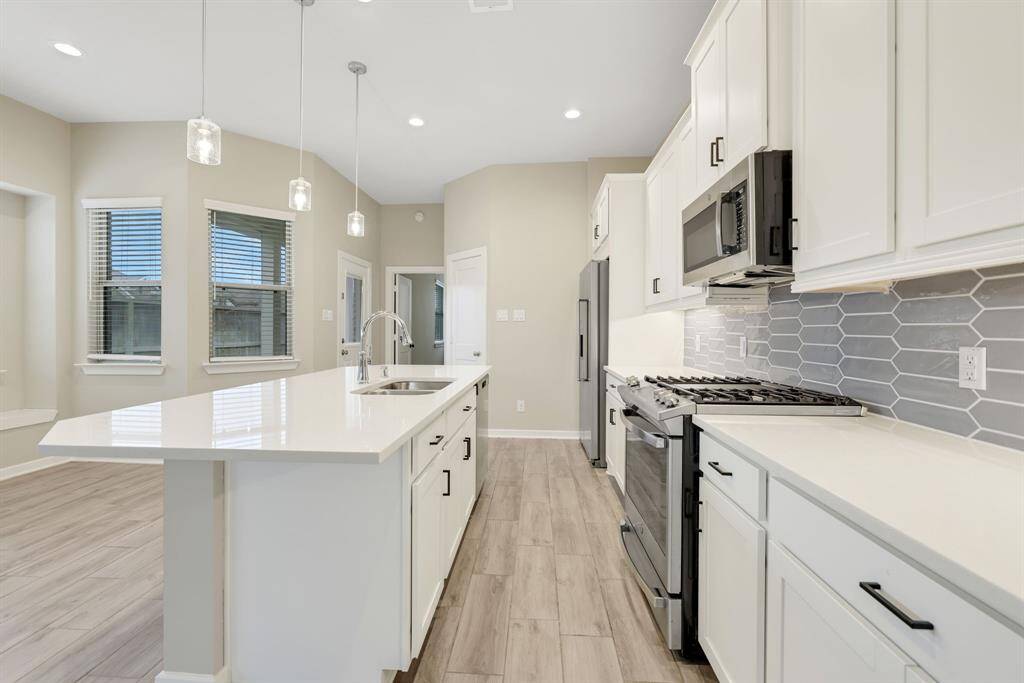 You’ll enjoy cooking in this kitchen with a breakfast /serving bar
