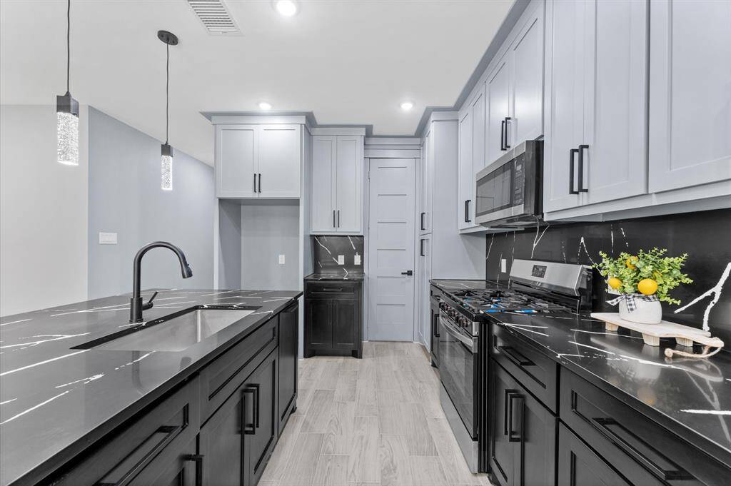 Stunning open-concept layout, where the kitchen seamlessly connects to the dining and living areas.