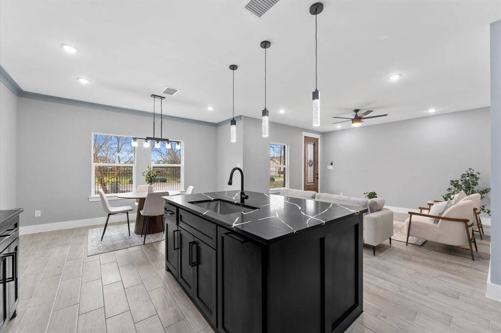 The living room is designed for comfort and style, enhanced by LED lighting throughout, creating a bright and inviting atmosphere