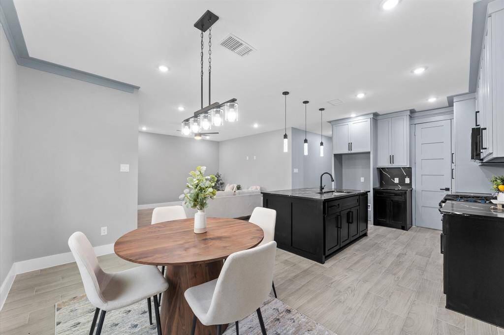 Large windows provide plenty of natural light, making the space feel even more expansive. Enjoy easy maintenance with stylish flooring throughout. No carpet.