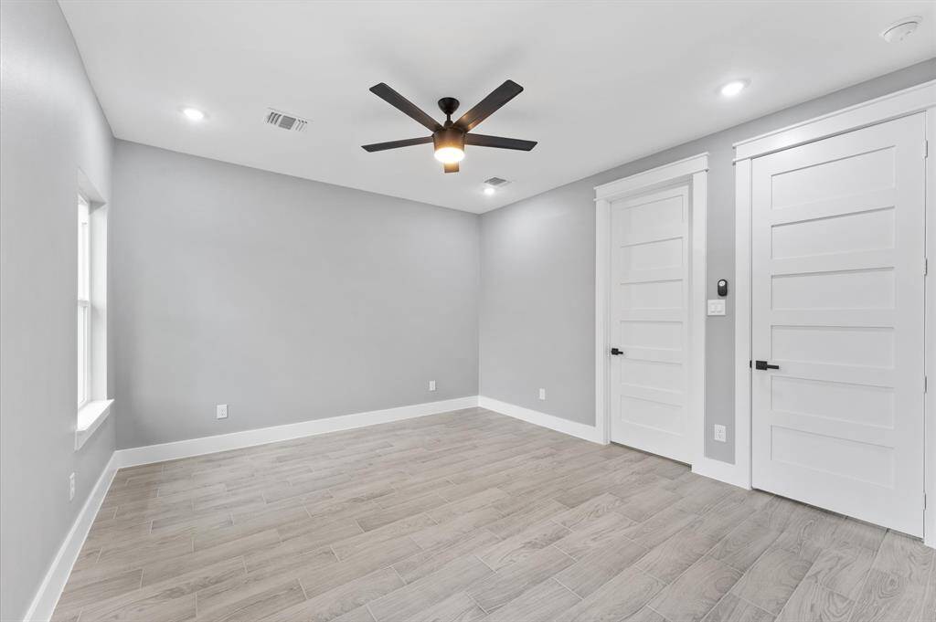 Primary bedrooms has a custom walk-in closet with built-in cabinetry.