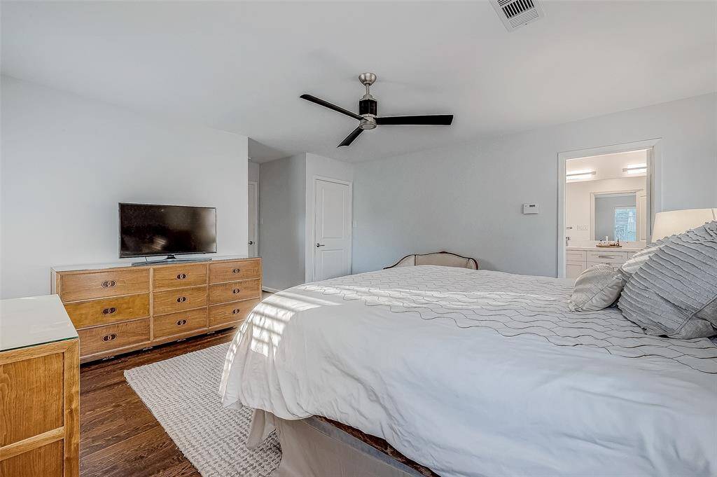 The door in the back leads to a large walk in closet.  The open door leads to the ensuite bathroom.
