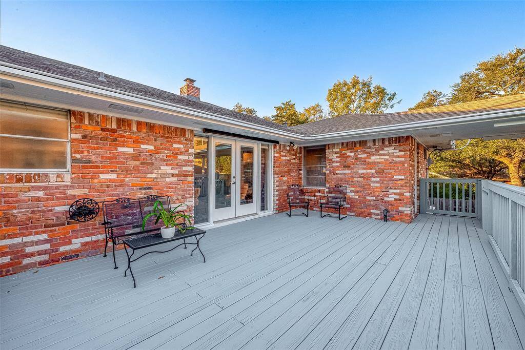 Another view of the deck.  The roof extends to the detached garage so you will not get wet if it is raining!