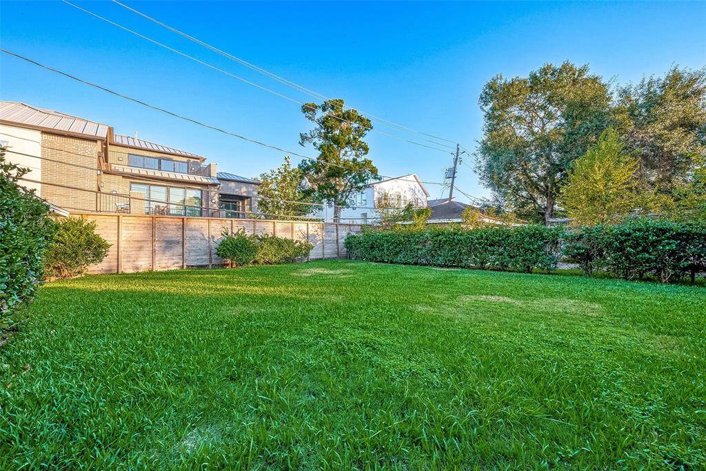 Fenced back yard. There is plenty of room to build a pool if you want one.