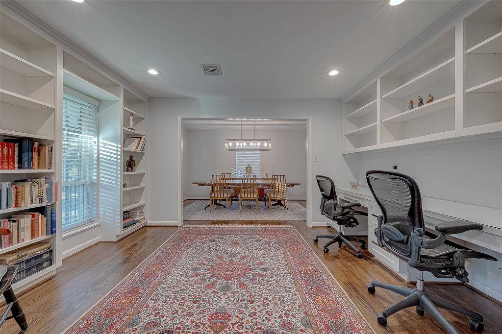 Another view of the home office with the dining room in the background.