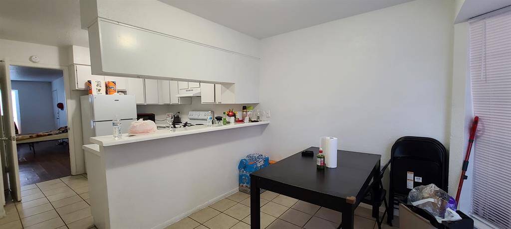 Kitchen opens to dining area