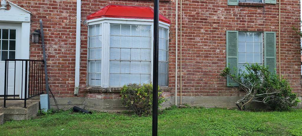 Apt 203  has a back door go to  the street.