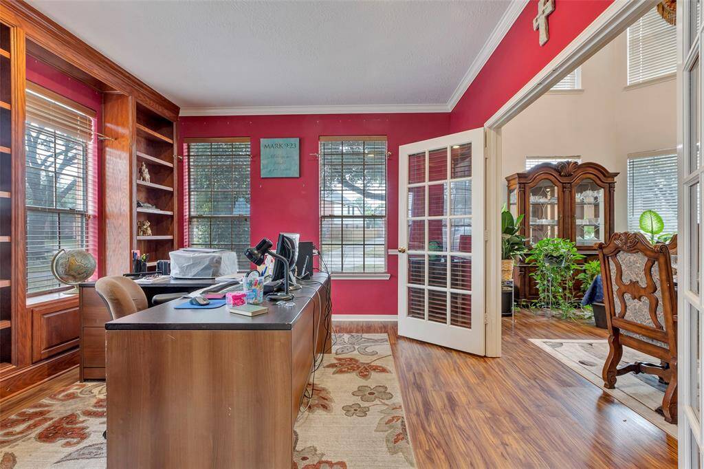 Formal office /study. French doors for privacy. Built in book cases, crown molding.