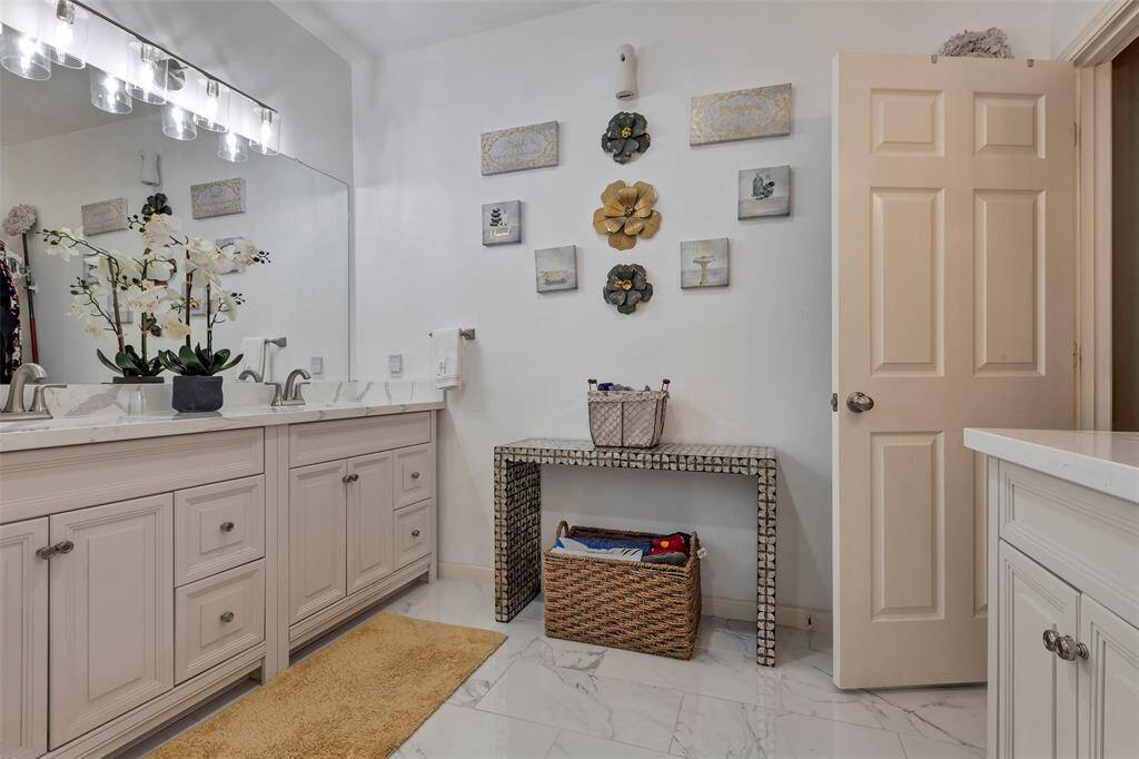 Quartz counters. Double sinks in primary bathroom. Updated 2024. Tile floors. Custom cabinets and drawers.