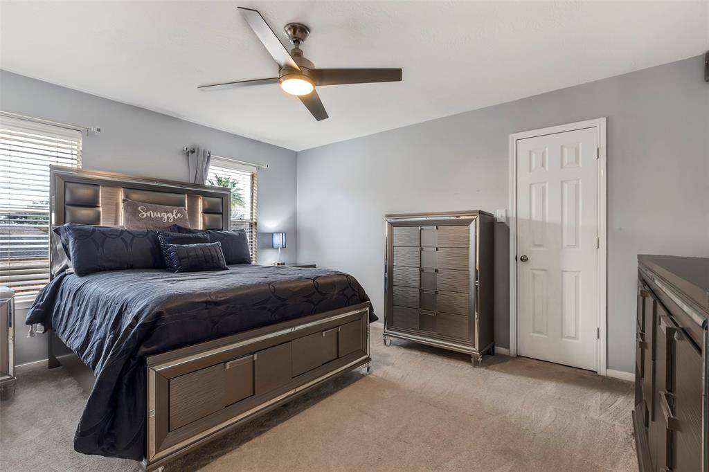 Fourth bedroom upstairs next to bathroom. Walkin closets. Lots of storage. Ceiling fan and custom window coverings. All carpet  in bedrooms 2023.