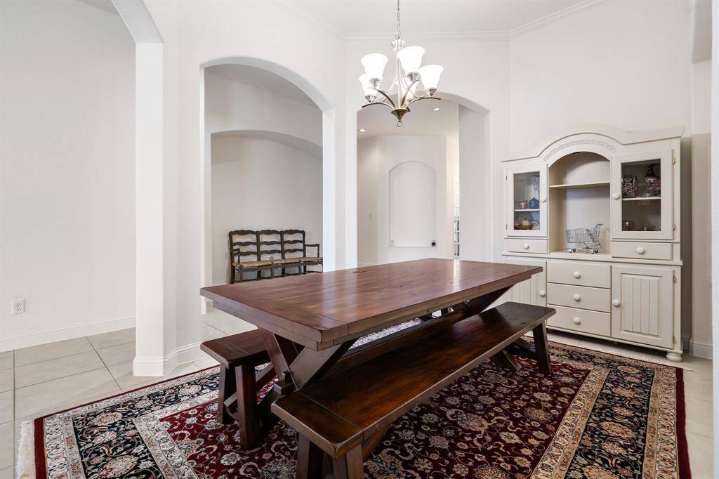 Beautiful hardwood floors add warmth and sophistication to this home office/den.