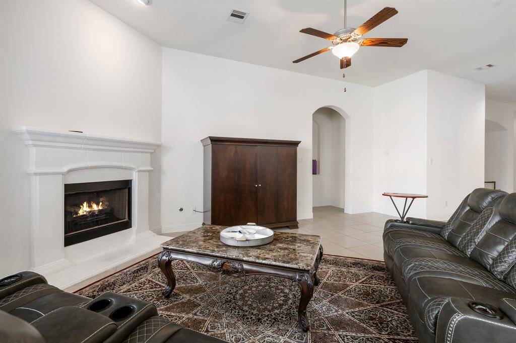 Dining room is framed by high, arched ceilings that add an airy and open feel.
