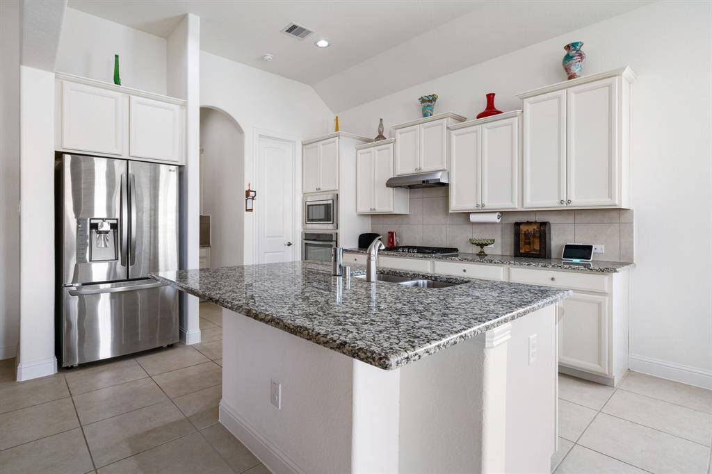 Arched entryways seamlessly connect dining room.