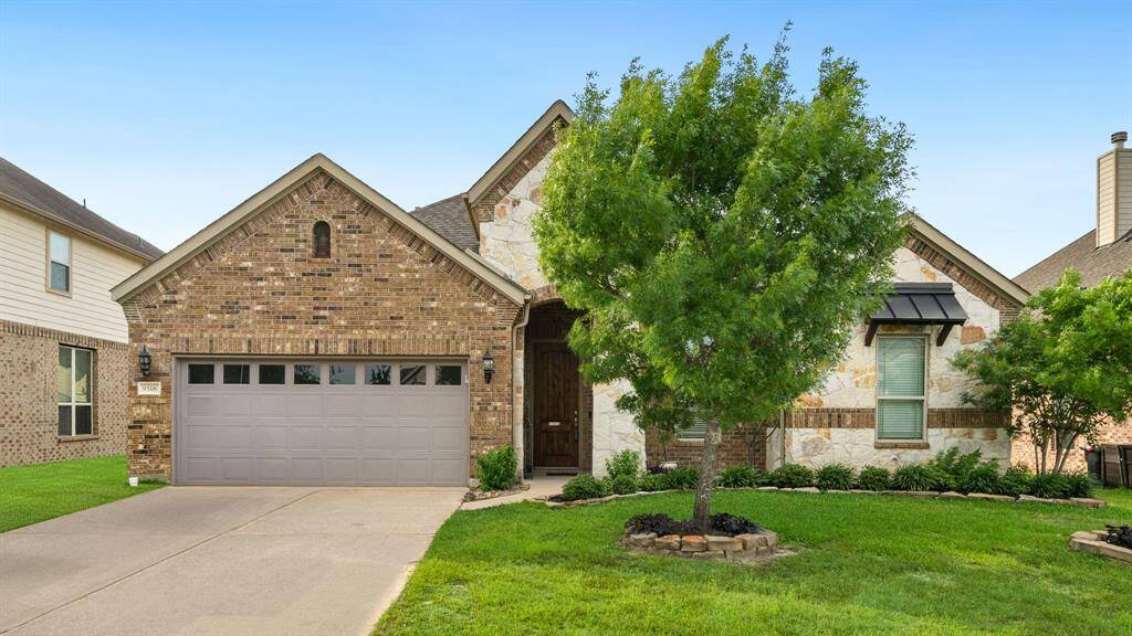 Large island includes a built-in stainless steel sink and dishwasher.