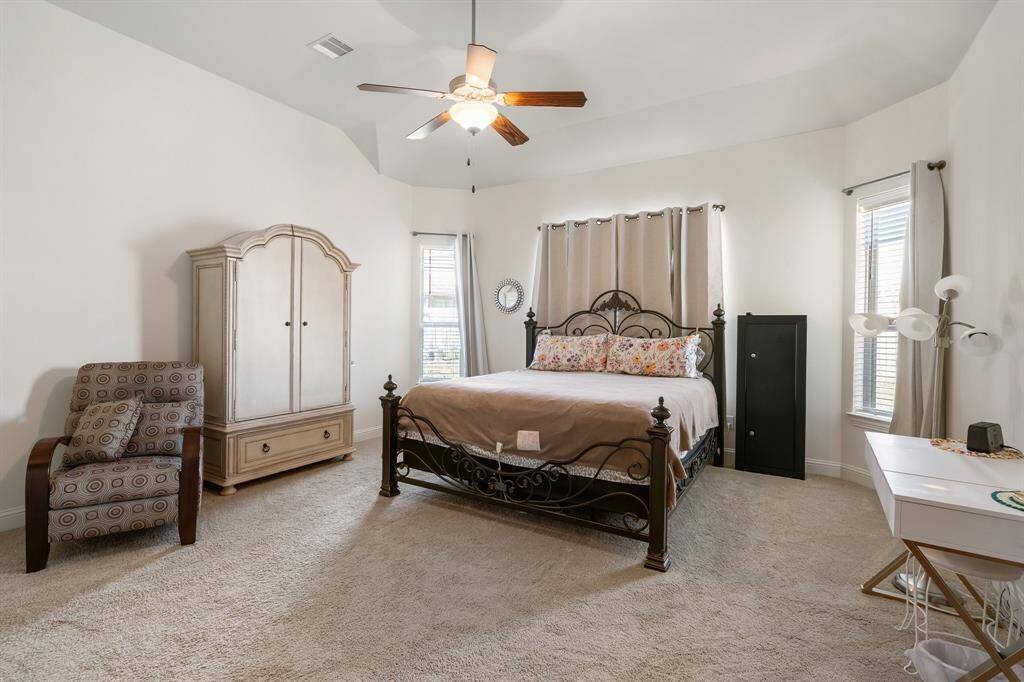 Bright and cozy breakfast nook with large windows and glass door that let in plenty of natural light.