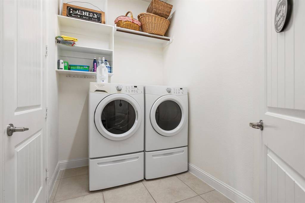 2nd bathroom features a large, sleek granite countertop with adjoining private shower-tub combo.