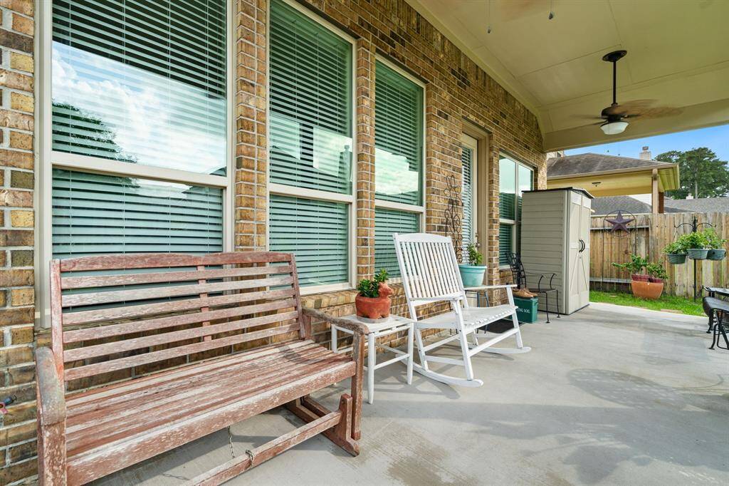 Expansive covered back porch provides ample space for relaxation, entertaining guests, or enjoying quiet mornings outdoors