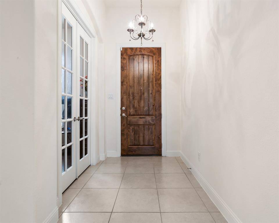 Patio includes ceiling fans and ample space, perfect for outdoor relaxation.