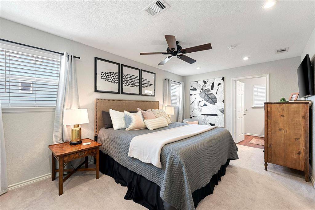 The primary suite has large closets, built-ins, and a large walk-in shower.
