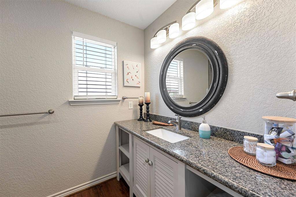 Primary bathroom with large walk-in shower.