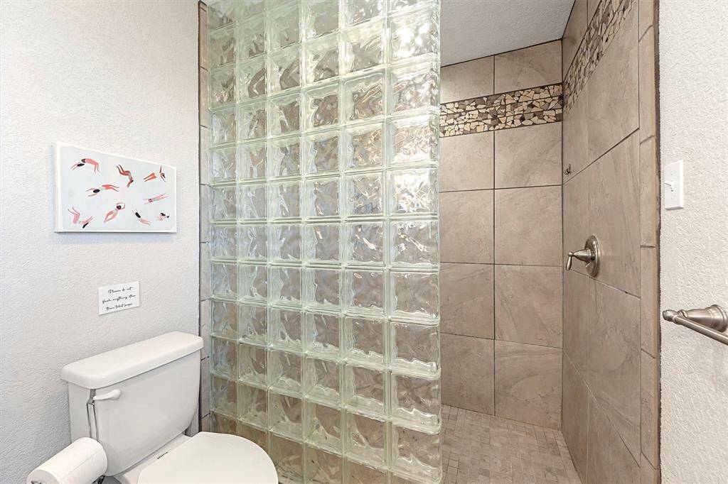 Primary bathroom with large walk-in shower.