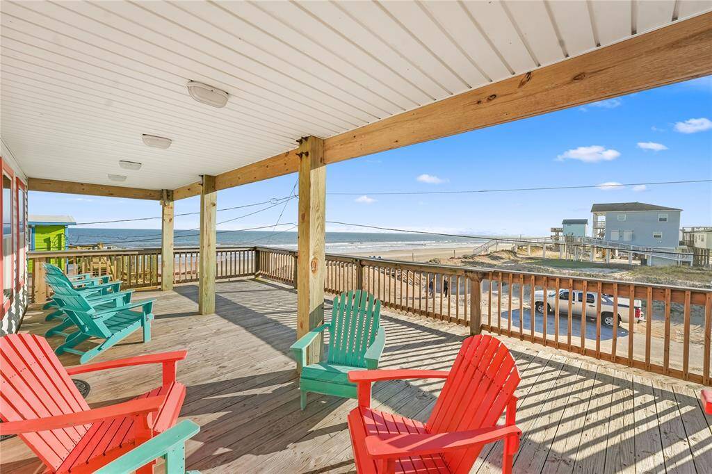 Steps away from the beach with two decks, ramp, golf cart garage, storage shed, outdoor shower, and incredible water views!